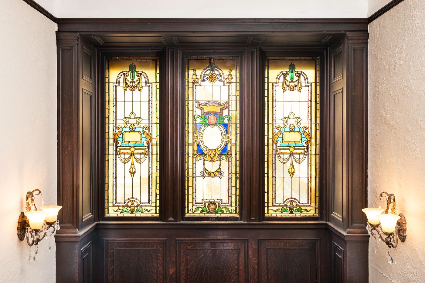 Original stained glass windows preserved during a historic Buffalo home remodel