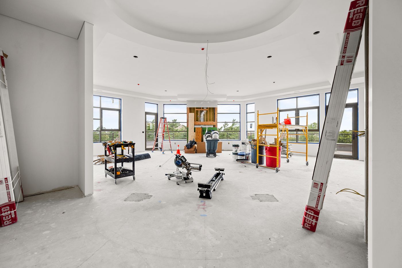Building envelope phase: interior shell with windows installed on a new construction project