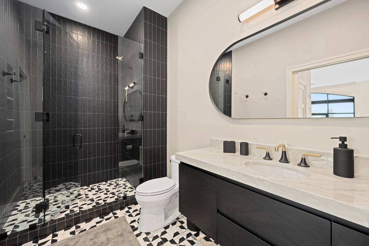 Rental photography, dark tiled shower bath